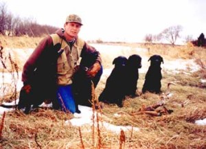 Hunter with black labs